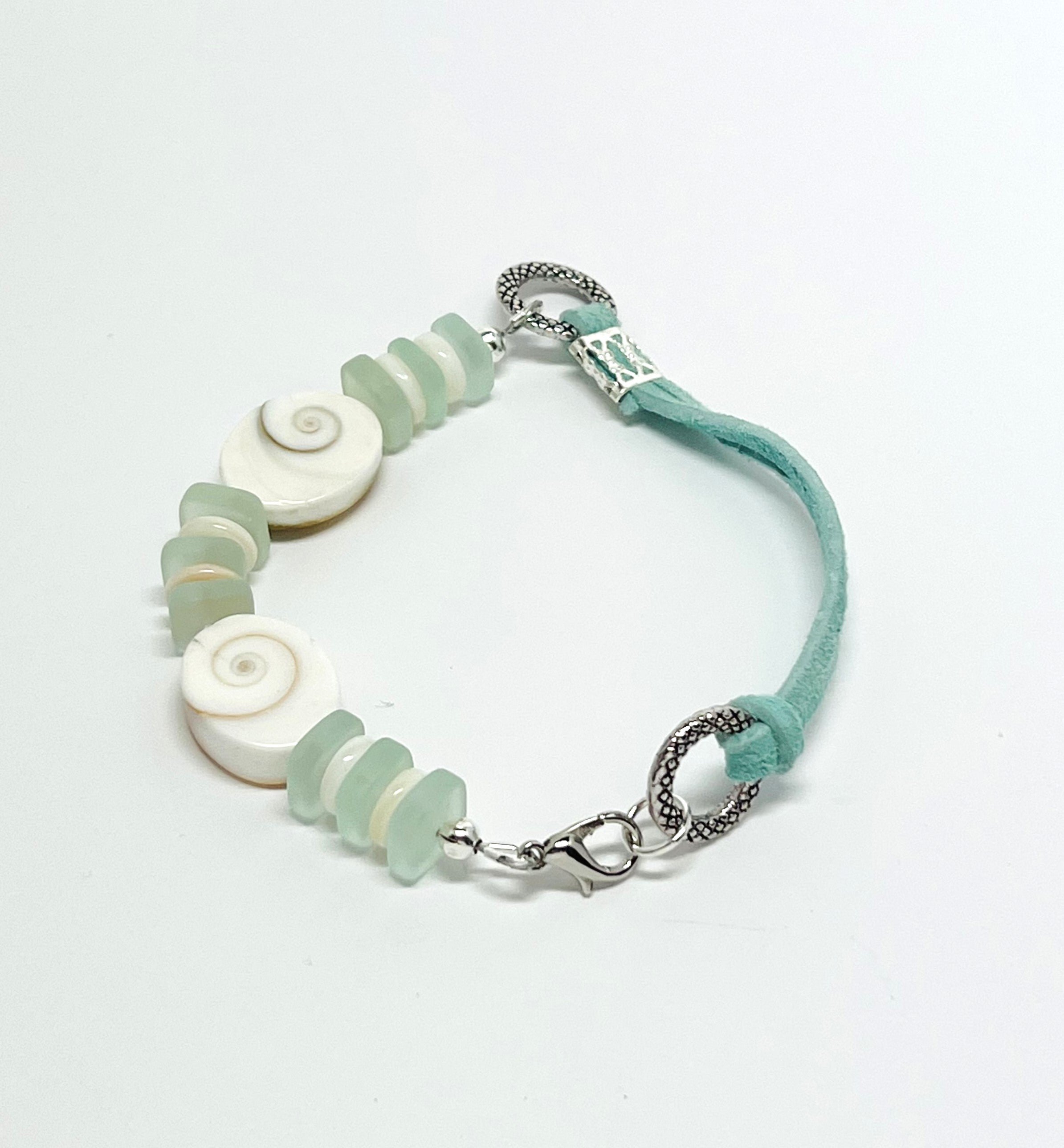 Simple and classic sea shell, leather, and frosted sea glass beads in mint green