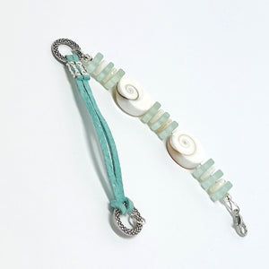 Simple and classic sea shell, leather, and frosted sea glass beads in mint green