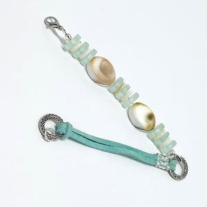 Simple and classic sea shell, leather, and frosted sea glass beads in mint green