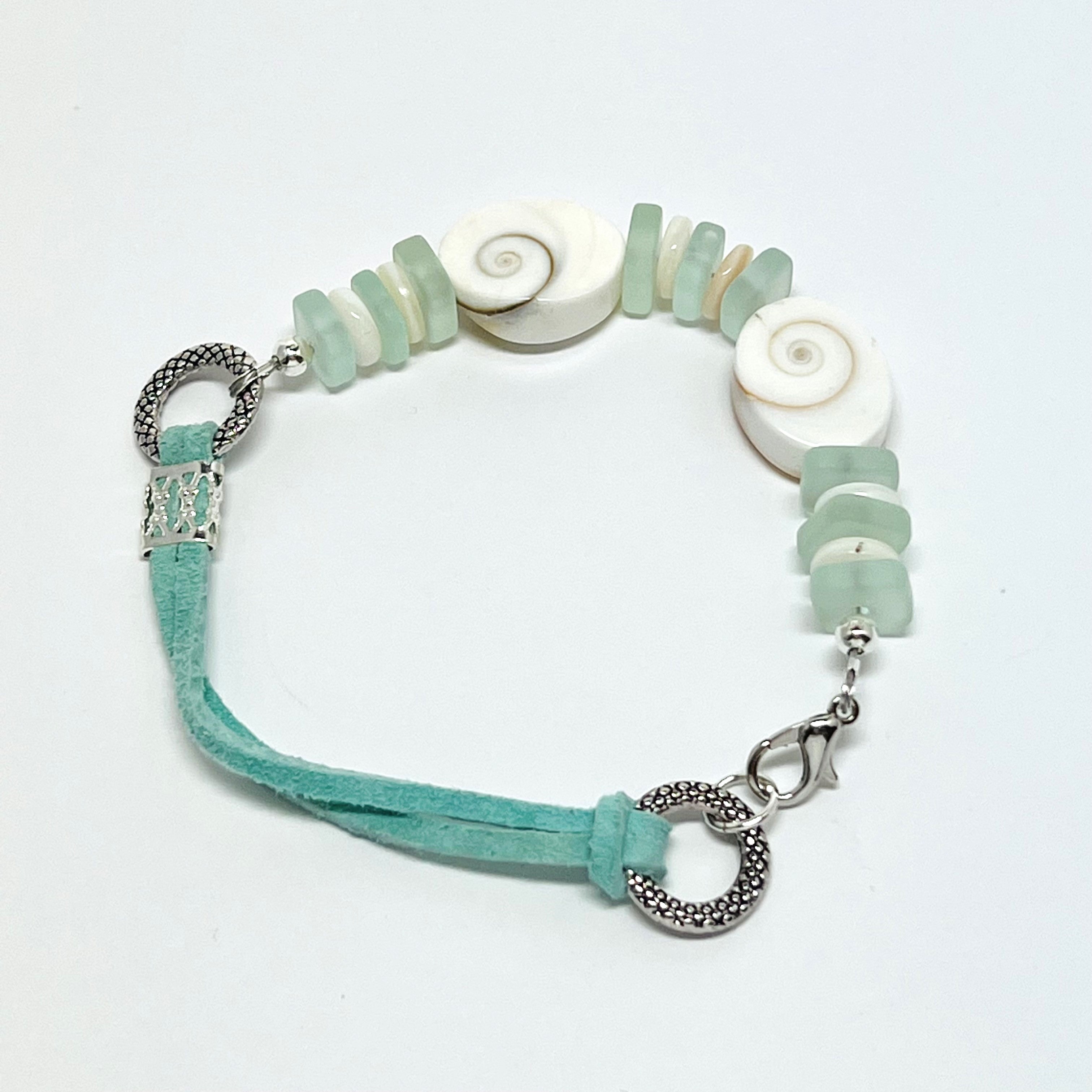 Simple and classic sea shell, leather, and frosted sea glass beads in mint green