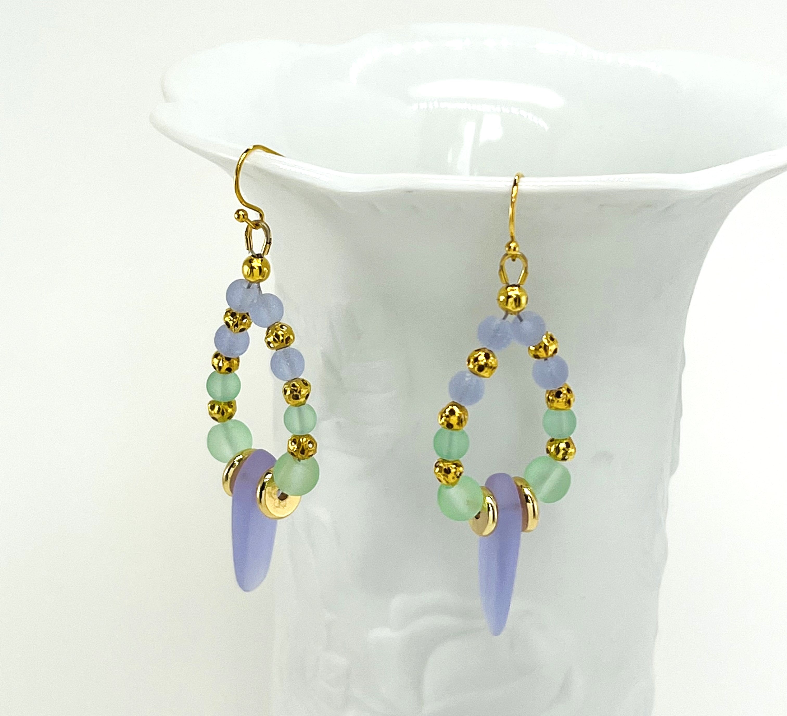 Sensitive lilac and mint green sea glass beads complimented with gold plated accents bracelet and earring set