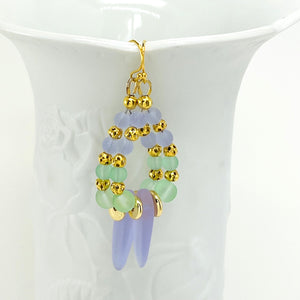 Sensitive lilac and mint green sea glass beads complimented with gold plated accents bracelet and earring set