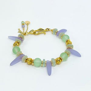 Sensitive lilac and mint green sea glass beads complimented with gold plated accents bracelet and earring set