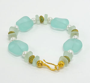 Beachy aqua sea glass look with glass pearls and gold plated accents