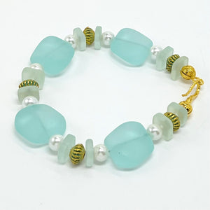 Beachy aqua sea glass look with glass pearls and gold plated accents