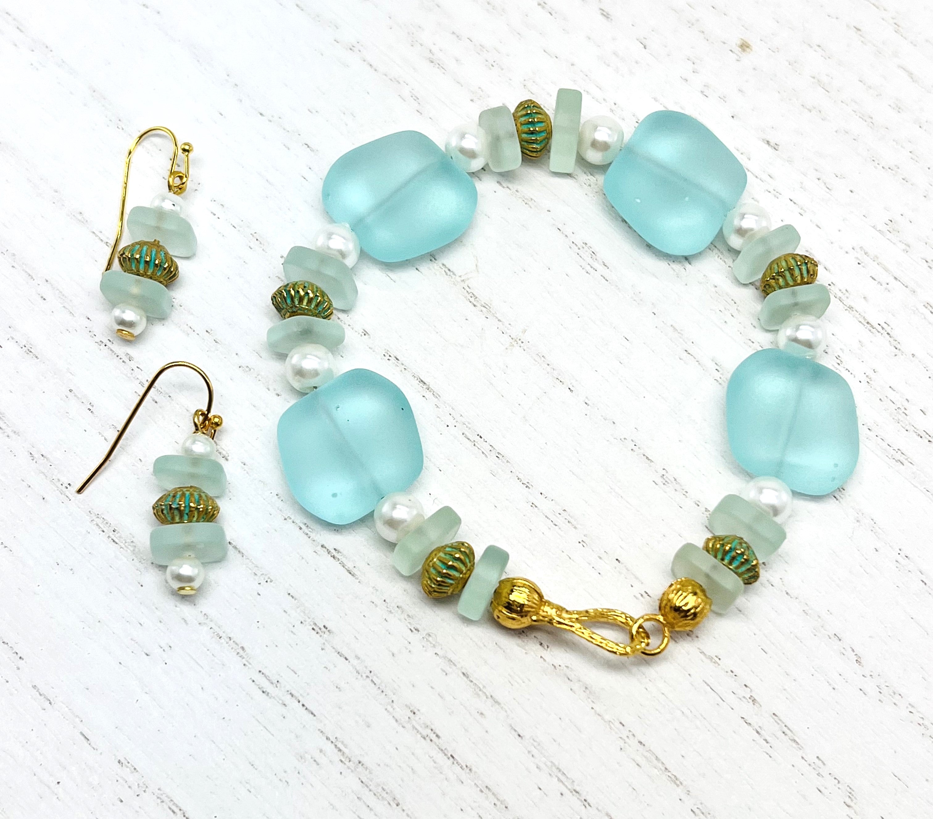 Beachy aqua sea glass look with glass pearls and gold plated accents