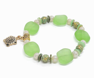 Ocean green sea glass look with glass, shell and gold plated metal accents and turtle charm bracelet and earring set