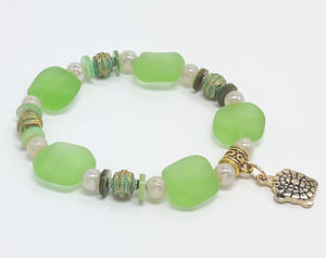 Ocean green sea glass look with glass, shell and gold plated metal accents and turtle charm bracelet and earring set