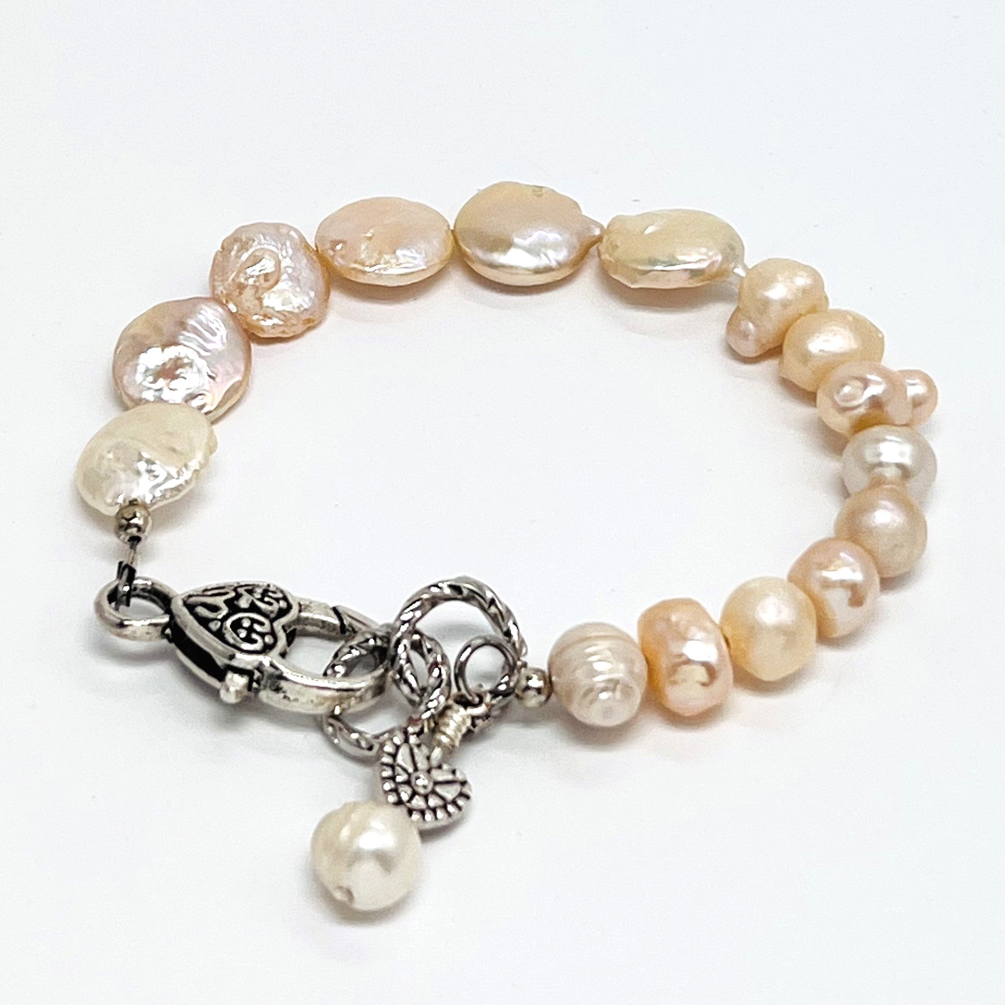 Lovely creamy color freshwater pearls and coin shaped pearls with silver plated accents