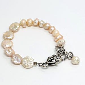 Lovely creamy color freshwater pearls and coin shaped pearls with silver plated accents