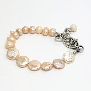 Lovely creamy color freshwater pearls and coin shaped pearls with silver plated accents