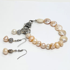 Lovely creamy color freshwater pearls and coin shaped pearls with silver plated accents