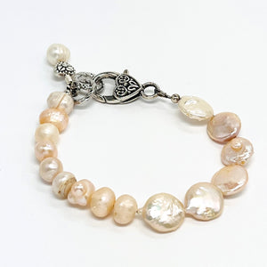 Lovely creamy color freshwater pearls and coin shaped pearls with silver plated accents