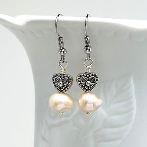 Lovely creamy color freshwater pearls and coin shaped pearls with silver plated accents