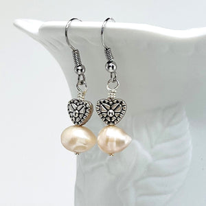 Lovely creamy color freshwater pearls and coin shaped pearls with silver plated accents