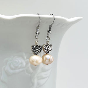 Lovely creamy color freshwater pearls and coin shaped pearls with silver plated accents