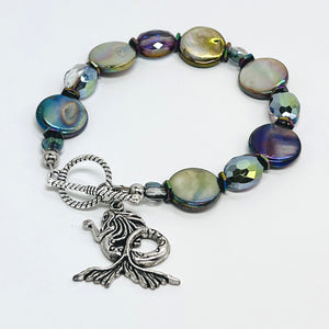 Mermaid bracelet reflecting iridescent aurora borealis shell coin beads with complementing cut glass