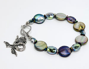 Mermaid bracelet reflecting iridescent aurora borealis shell coin beads with complementing cut glass