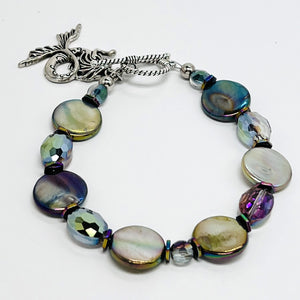 Mermaid bracelet reflecting iridescent aurora borealis shell coin beads with complementing cut glass