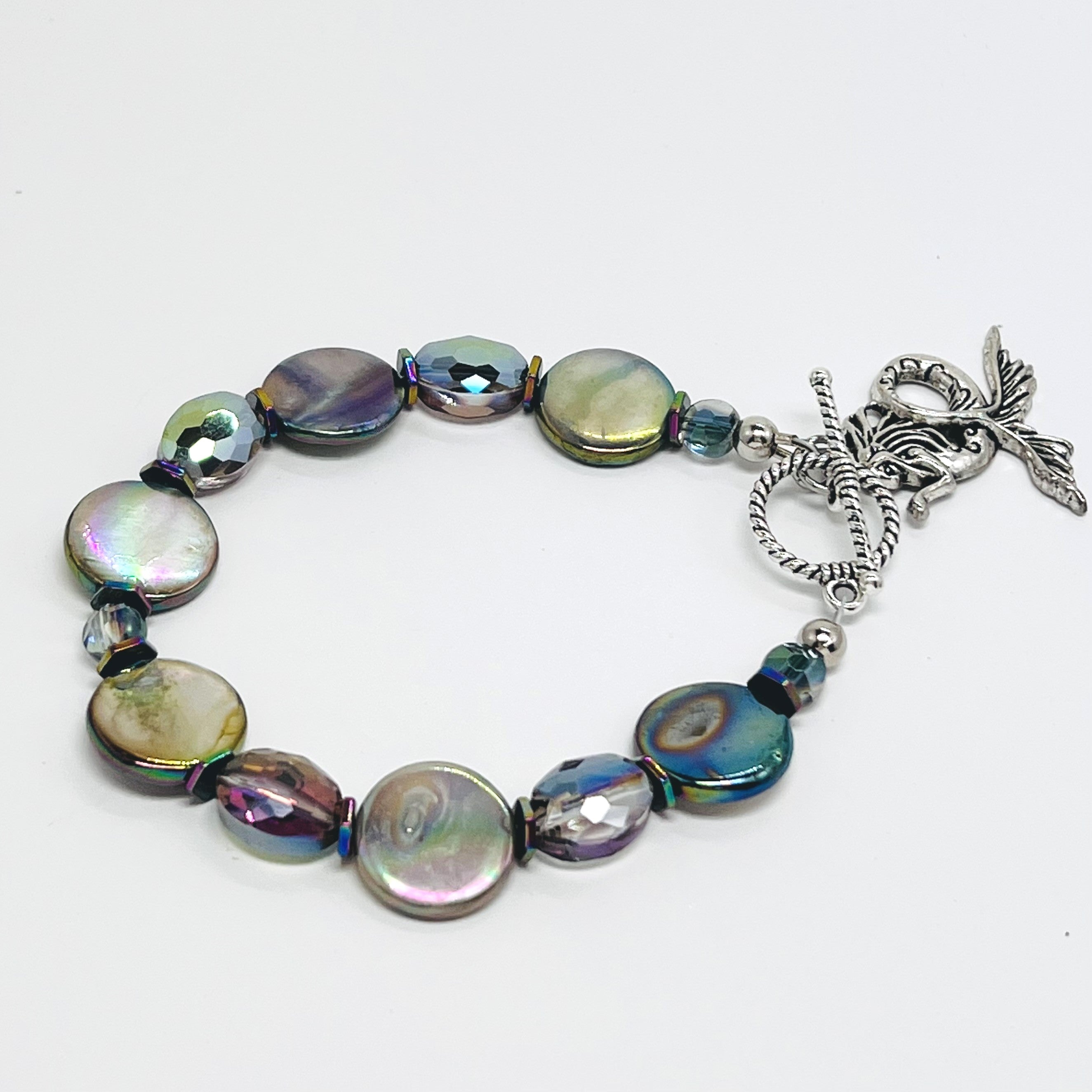 Mermaid bracelet reflecting iridescent aurora borealis shell coin beads with complementing cut glass