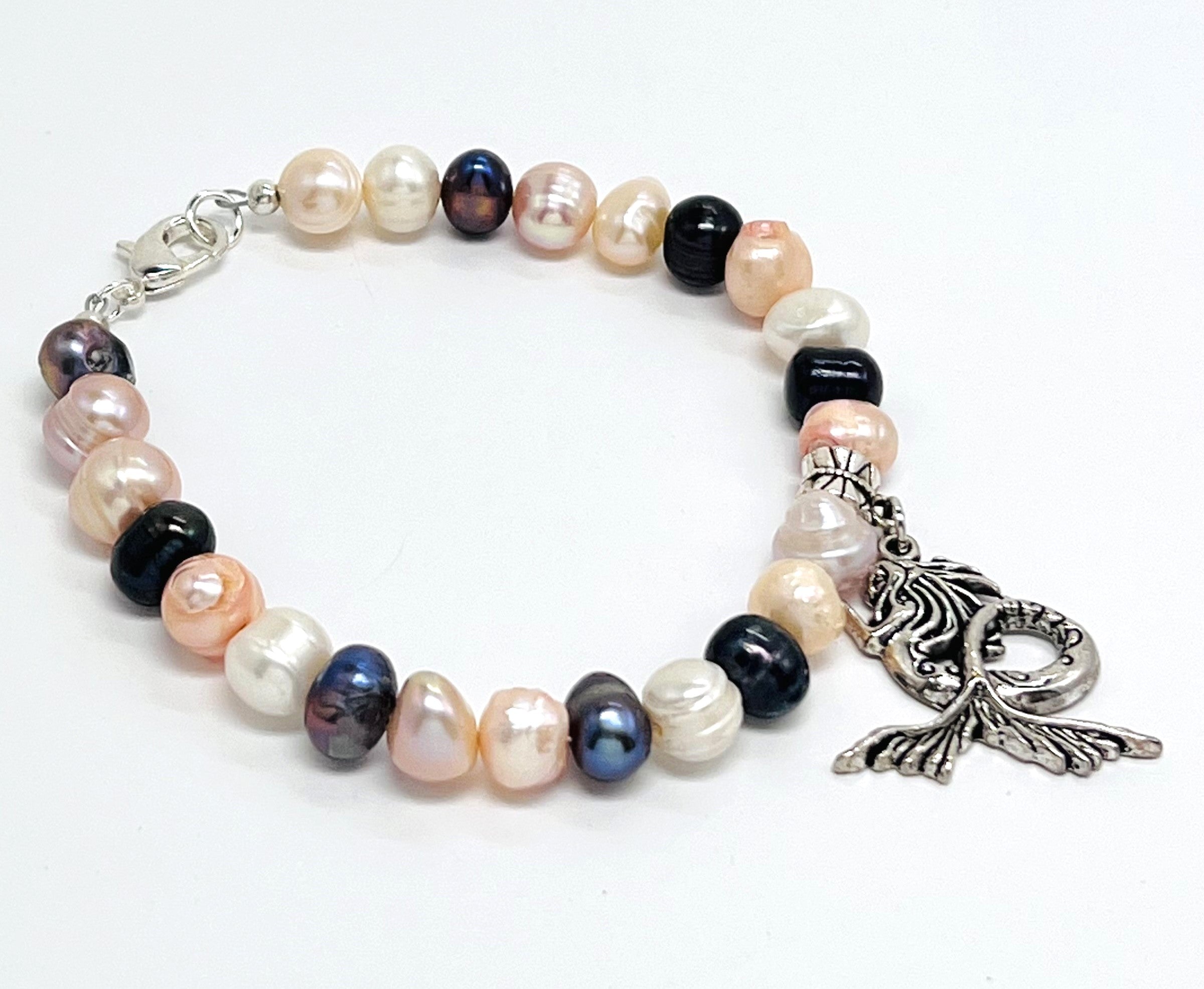 Multicolor fresh water pearls adorned with silver plated mermaid charm