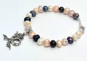 Multicolor fresh water pearls adorned with silver plated mermaid charm