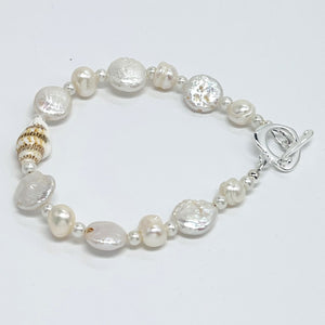 Creamy white fresh water pearls, coin pearls and natural sea shell