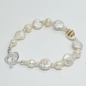 Creamy white fresh water pearls, coin pearls and natural sea shell