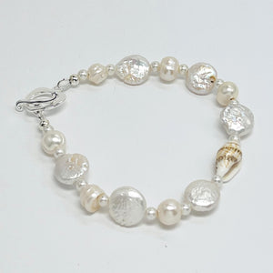 Creamy white fresh water pearls, coin pearls and natural sea shell