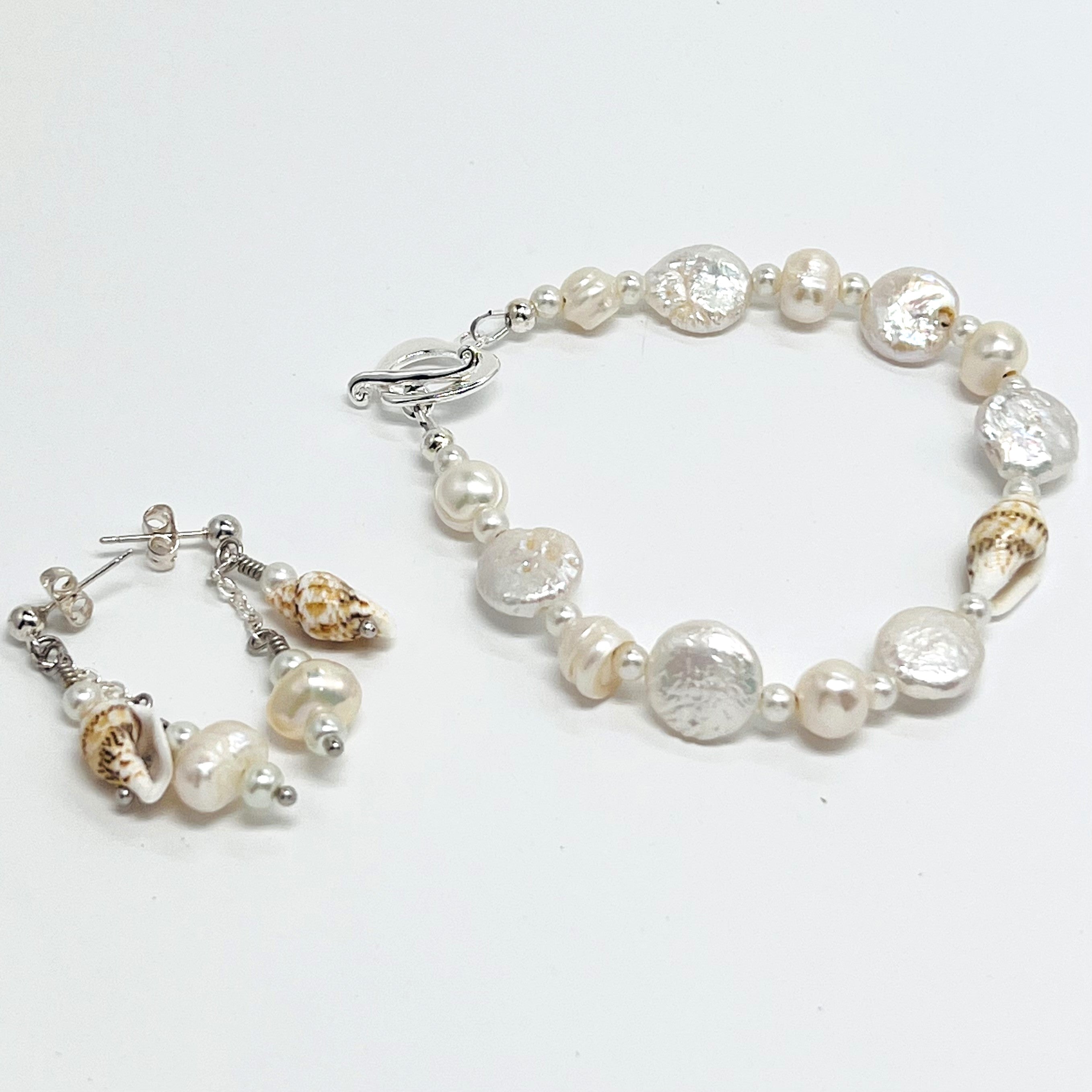 Creamy white fresh water pearls, coin pearls and natural sea shell