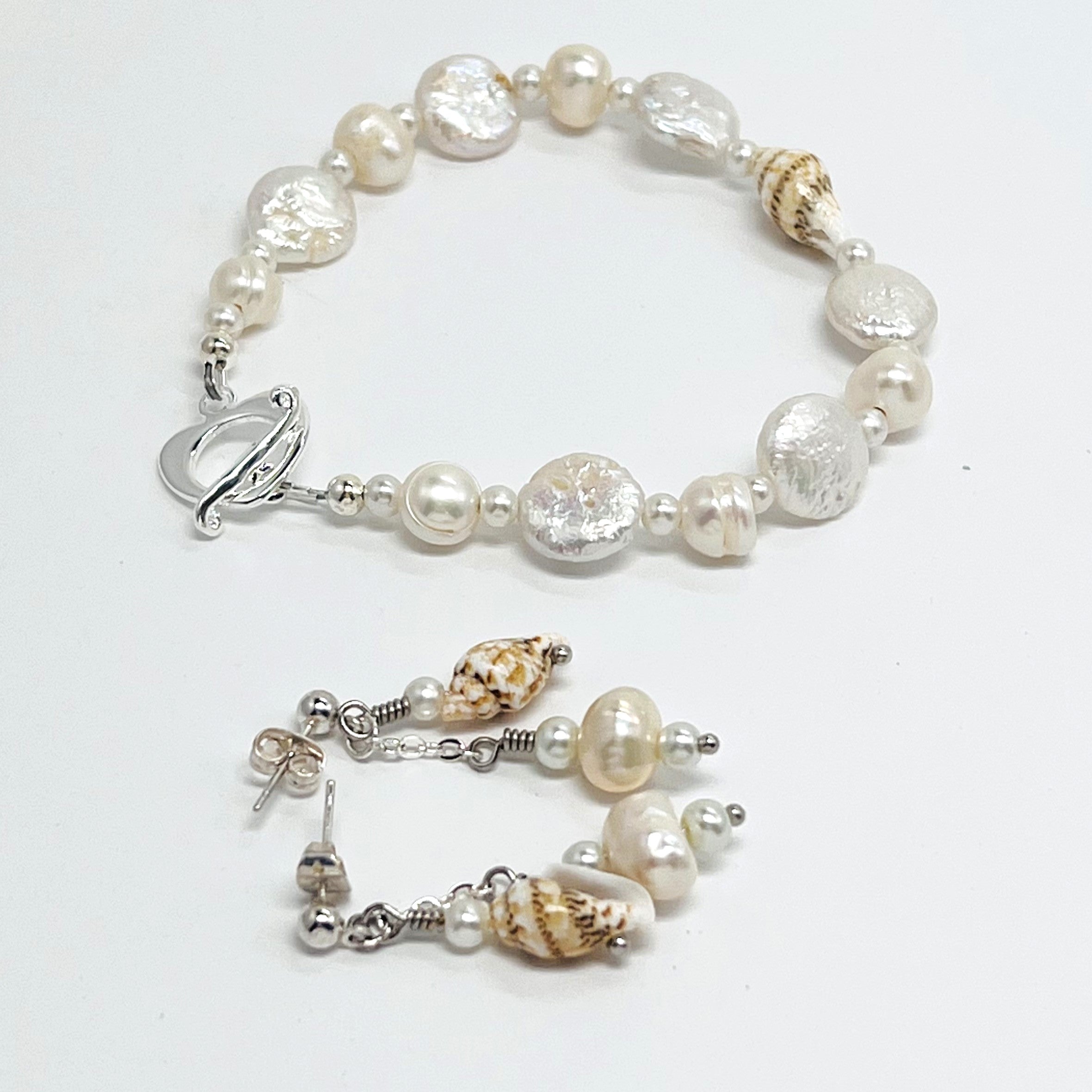 Creamy white fresh water pearls, coin pearls and natural sea shell