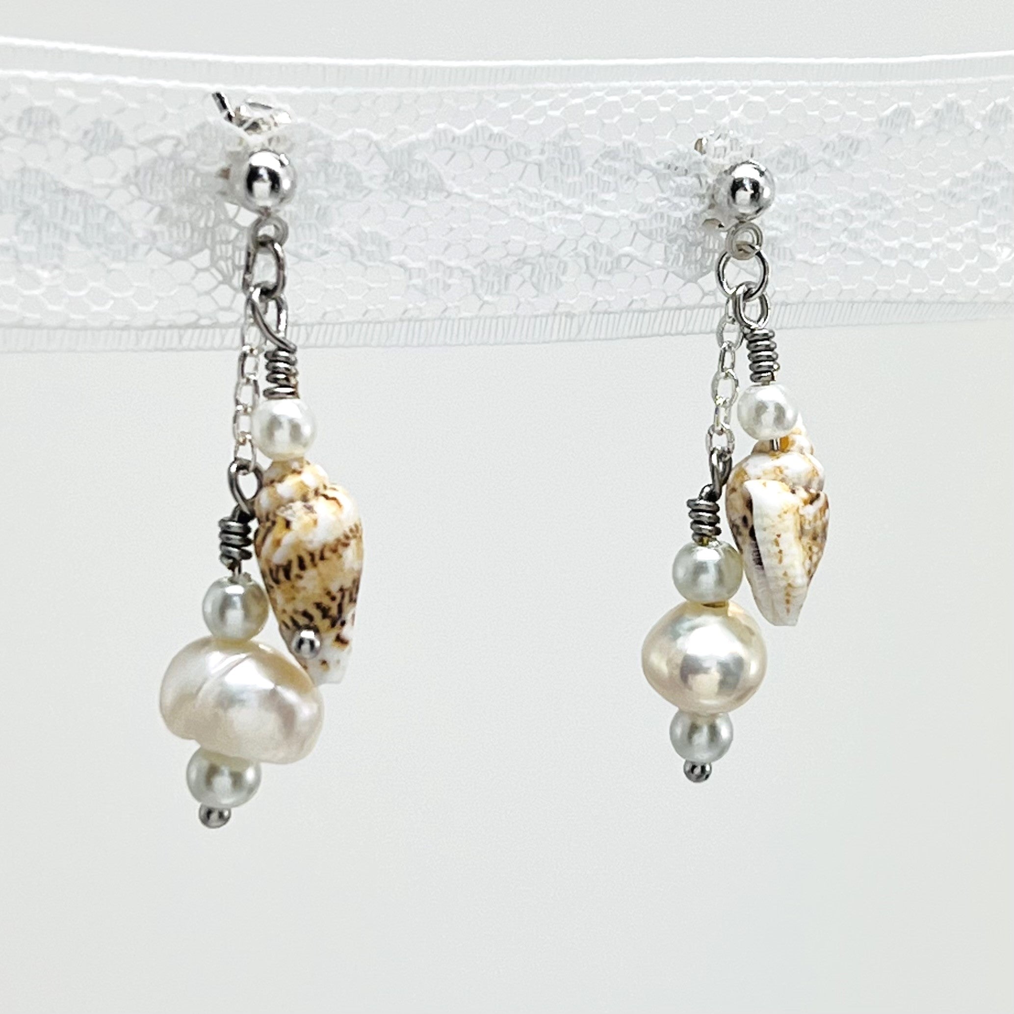 Creamy white fresh water pearls, coin pearls and natural sea shell