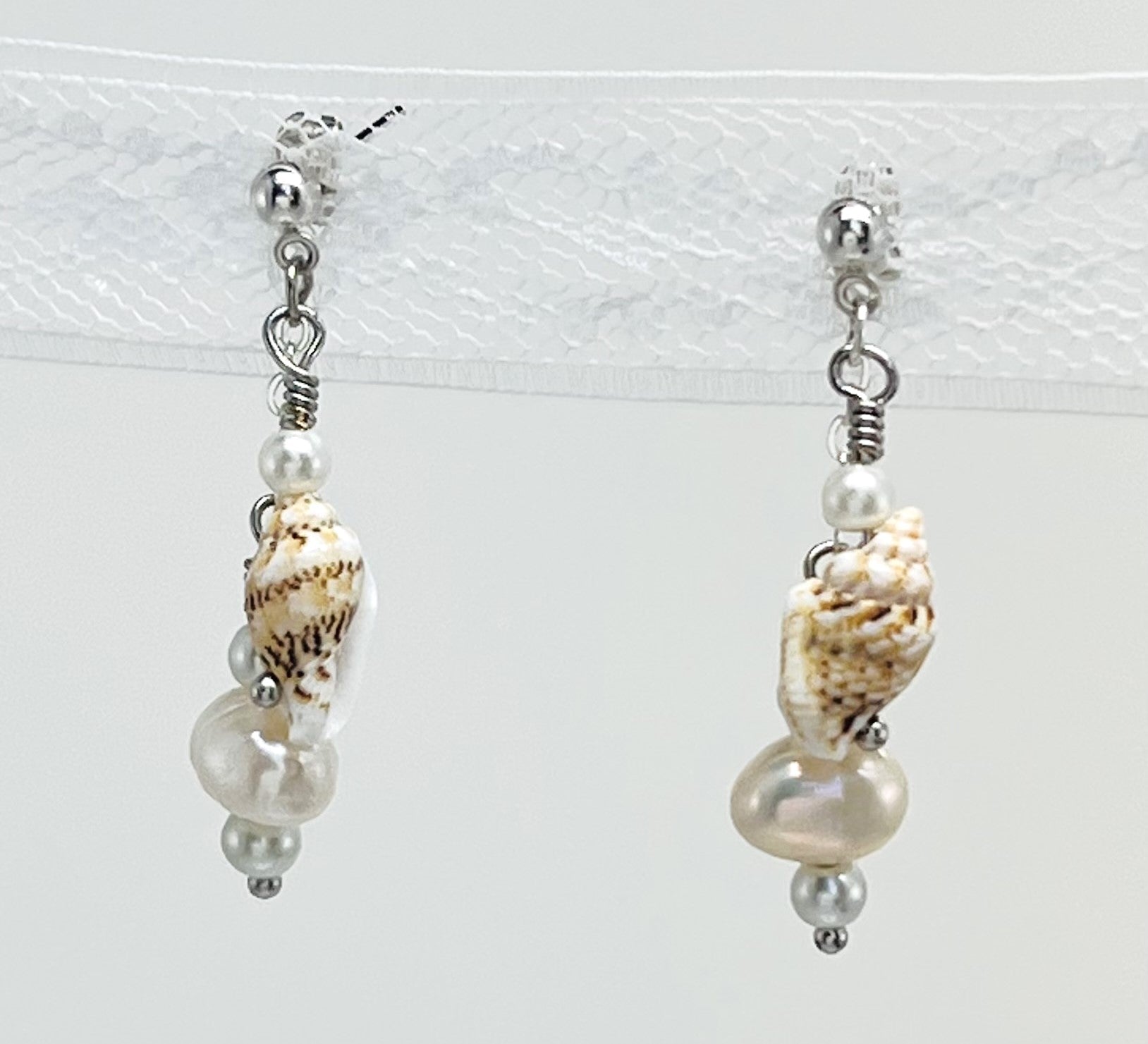 Creamy white fresh water pearls, coin pearls and natural sea shell