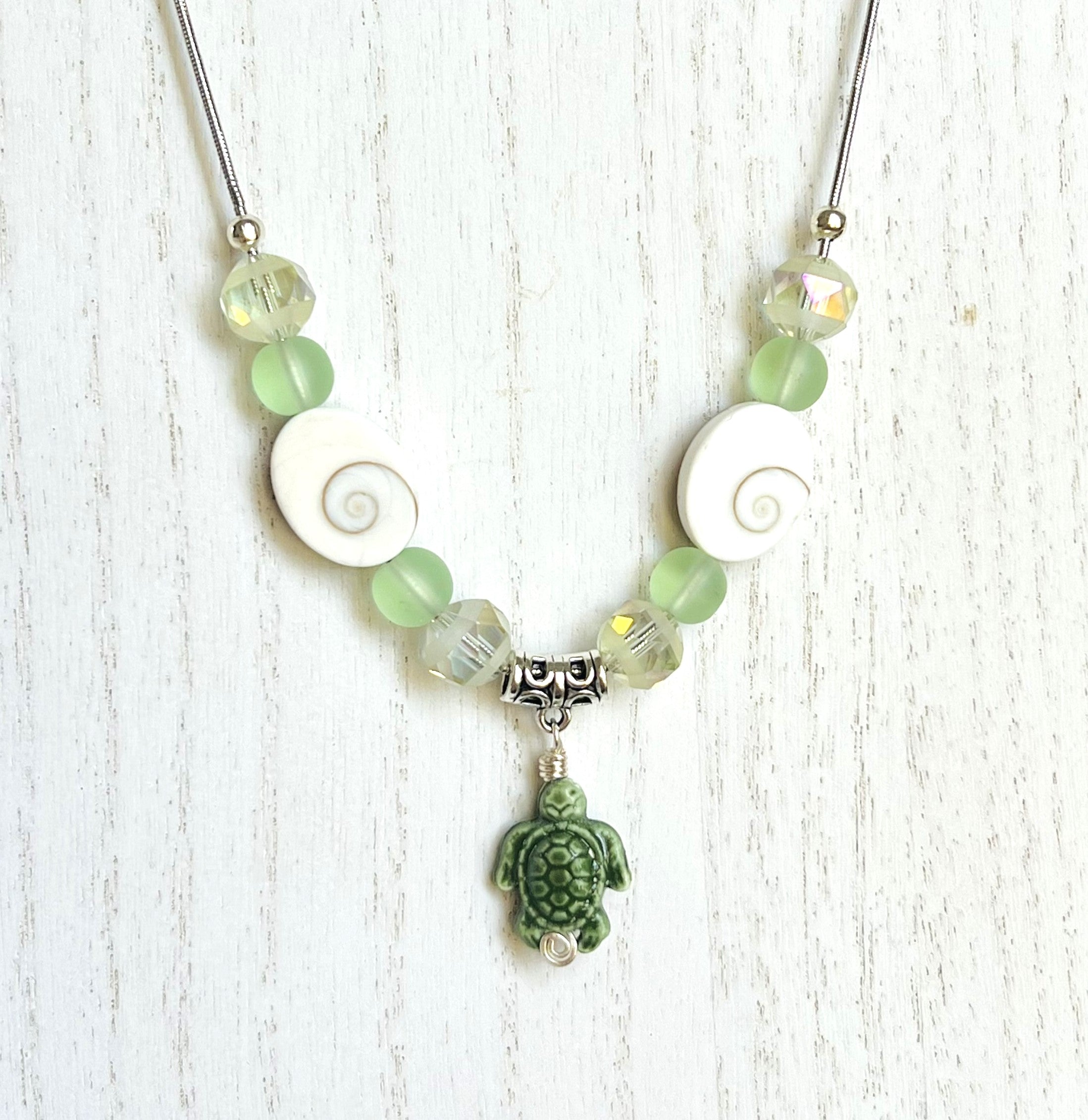 Beachy frosted mint sea glass and spiral shells necklace and earring set with a cute ceramic green turtle dangle