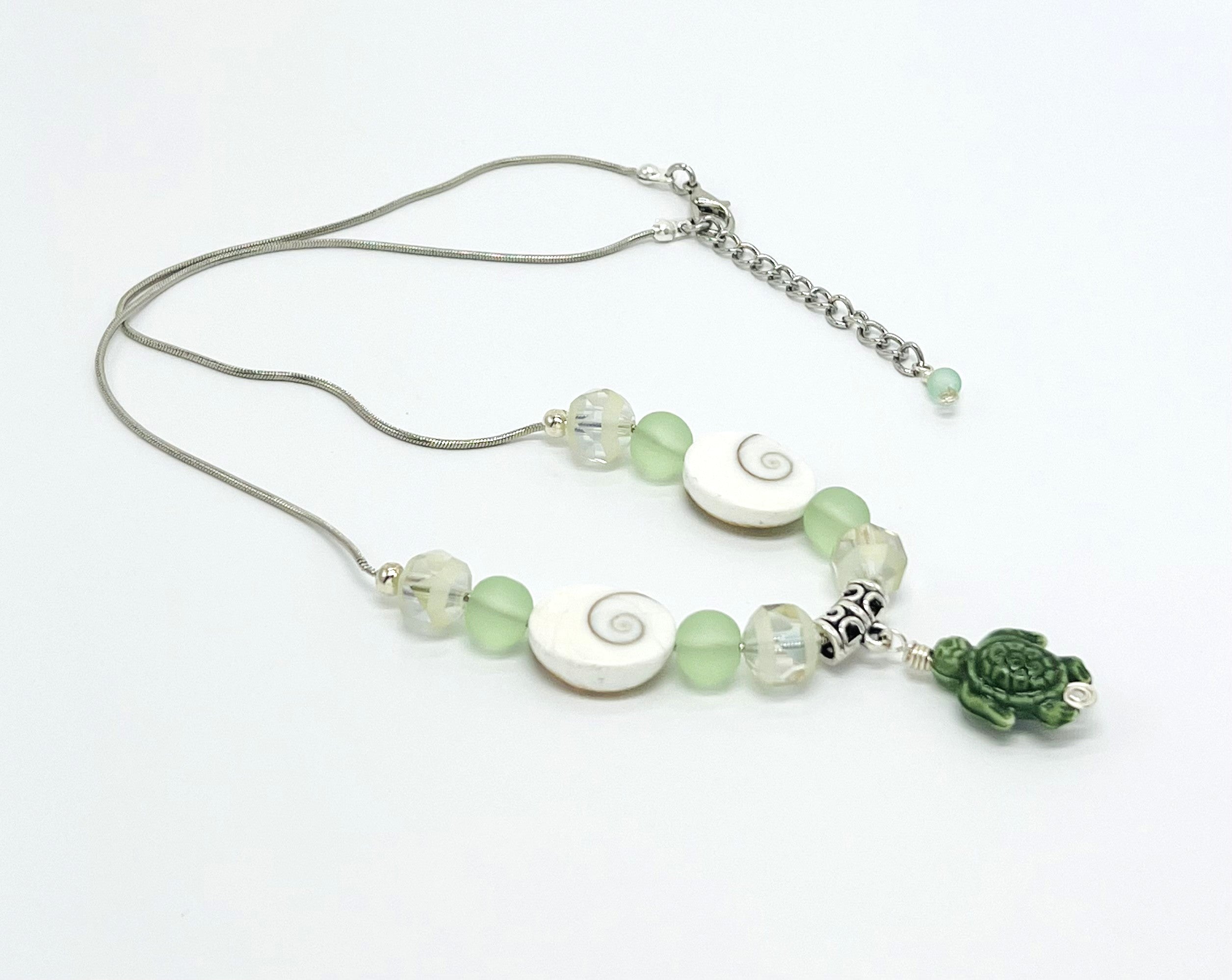 Beachy frosted mint sea glass and spiral shells necklace and earring set with a cute ceramic green turtle dangle