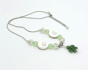 Beachy frosted mint sea glass and spiral shells necklace and earring set with a cute ceramic green turtle dangle