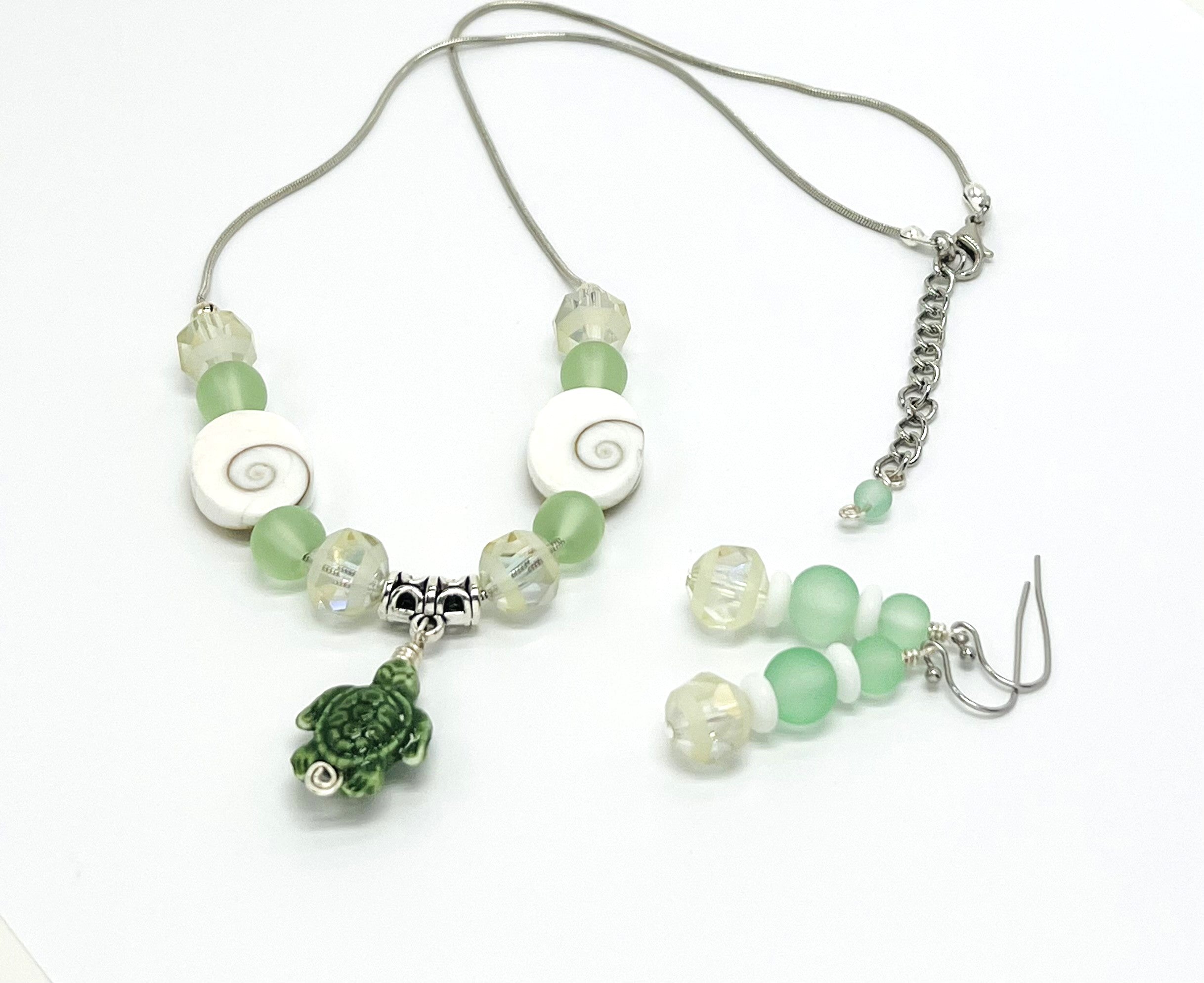 Beachy frosted mint sea glass and spiral shells necklace and earring set with a cute ceramic green turtle dangle