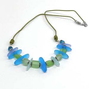 Leather necklace and earring set of frosty sea glass beads in the beautiful blue and green colors of the Caribbean sea