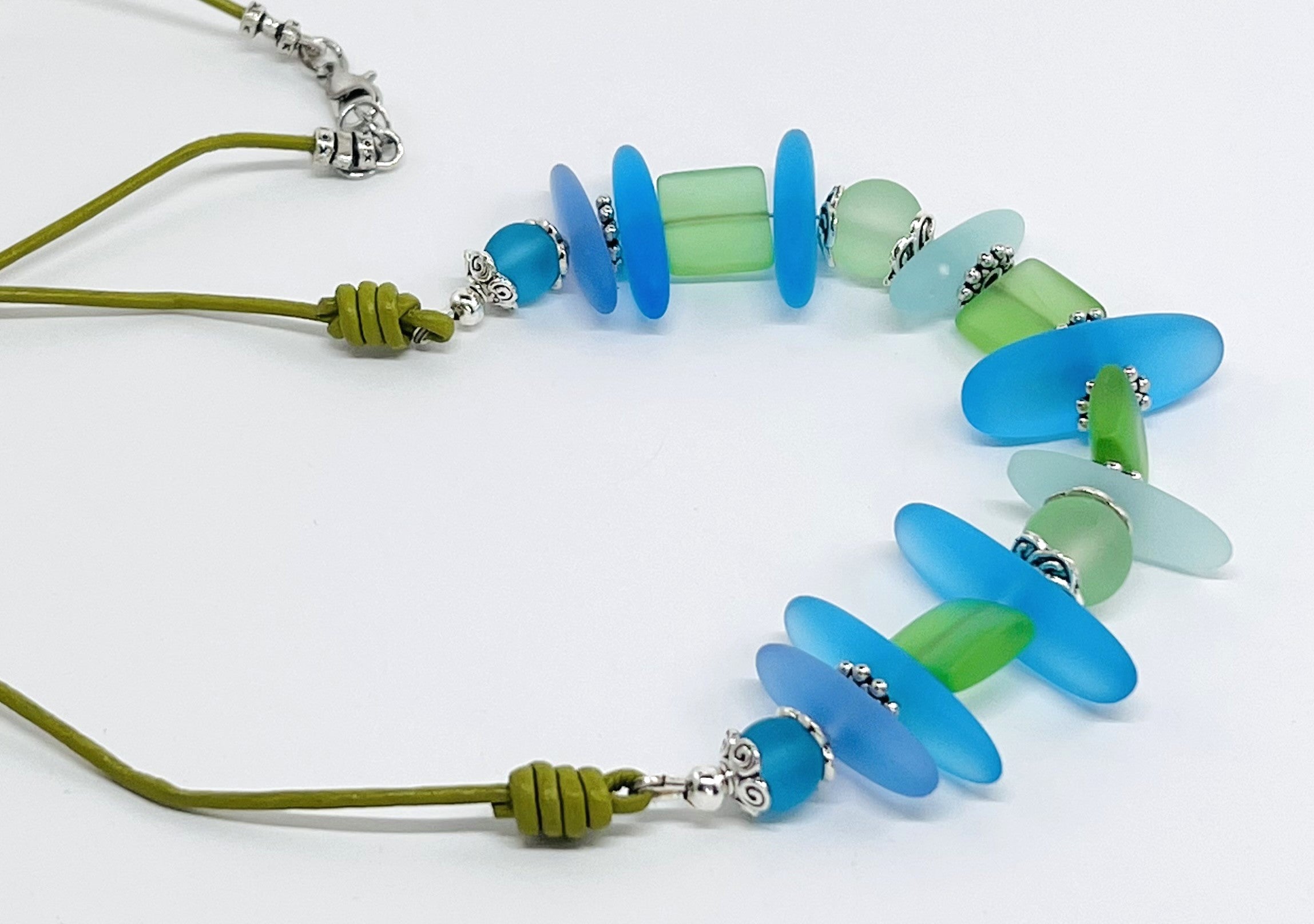 Leather necklace and earring set of frosty sea glass beads in the beautiful blue and green colors of the Caribbean sea