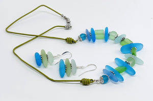 Leather necklace and earring set of frosty sea glass beads in the beautiful blue and green colors of the Caribbean sea