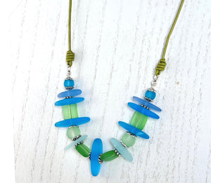 Leather necklace and earring set of frosty sea glass beads in the beautiful blue and green colors of the Caribbean sea