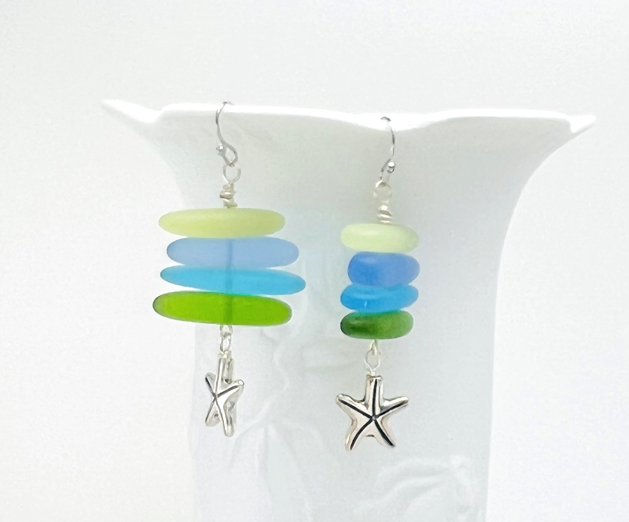 Cool Caribbean sea colors in frosty blue and green sea glass beads hanging on a silver plated snake chain with matching earrings