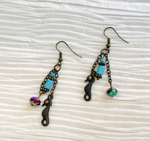 Seahorse earrings with turquoise and rainbow colored glass beads with antique brass ear wires