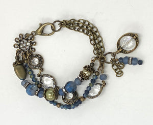 Majestic three strand bracelet of moss green and midnight blue crystal and glass beads