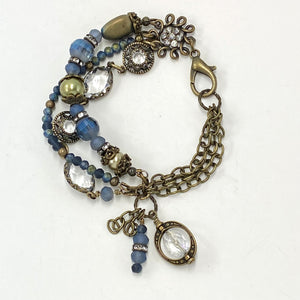 Majestic three strand bracelet of moss green and midnight blue crystal and glass beads