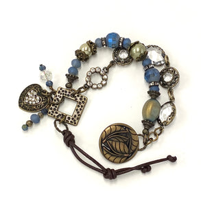 Enchanting double strand antique brass bracelet with glass beads and leather closure