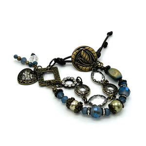 Enchanting double strand antique brass bracelet with glass beads and leather closure