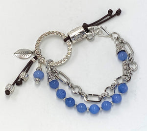 Spirited double strung silver plated, cool blue glass beaded bracelet and earring set