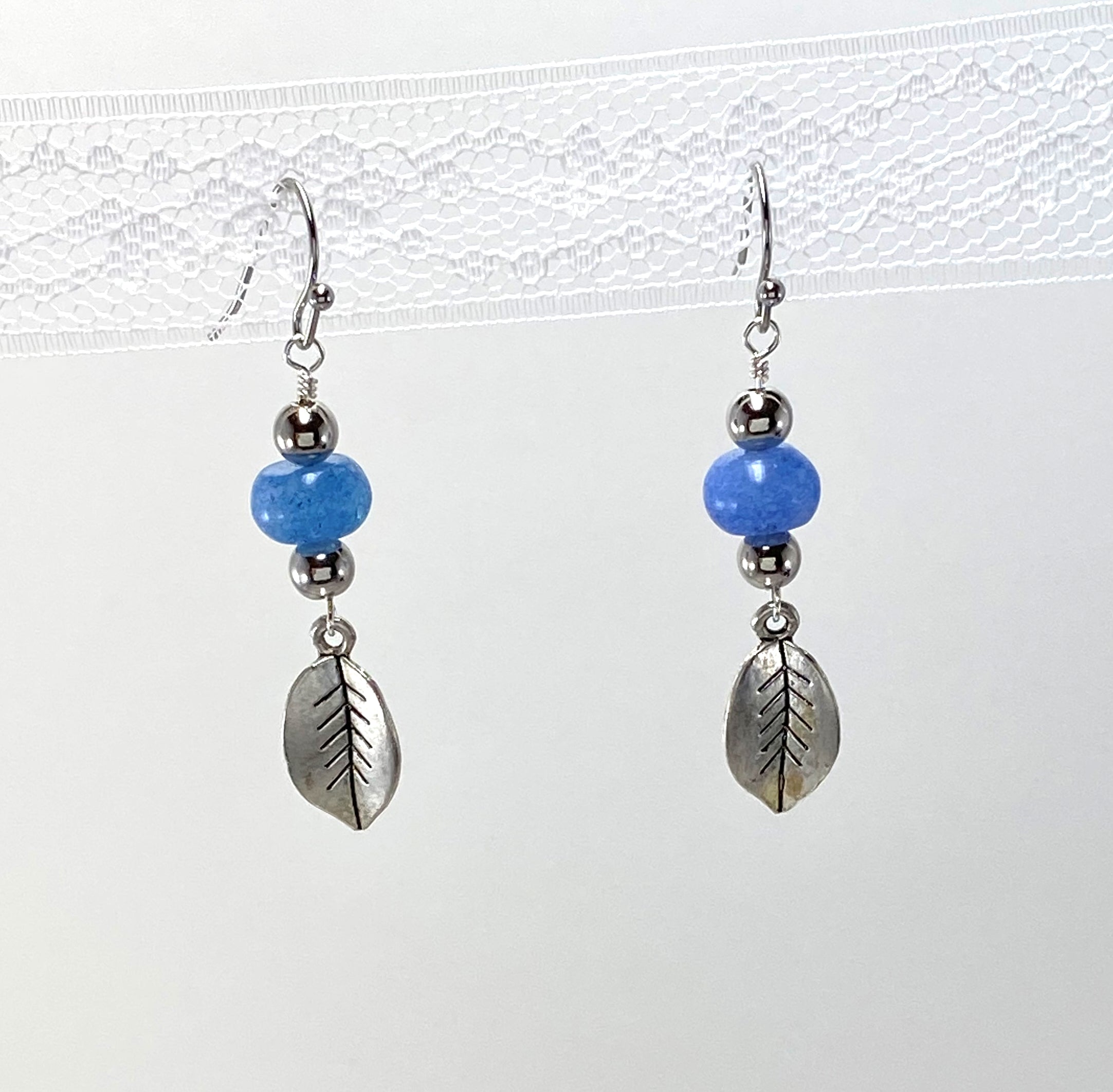 Spirited double strung silver plated, cool blue glass beaded bracelet and earring set