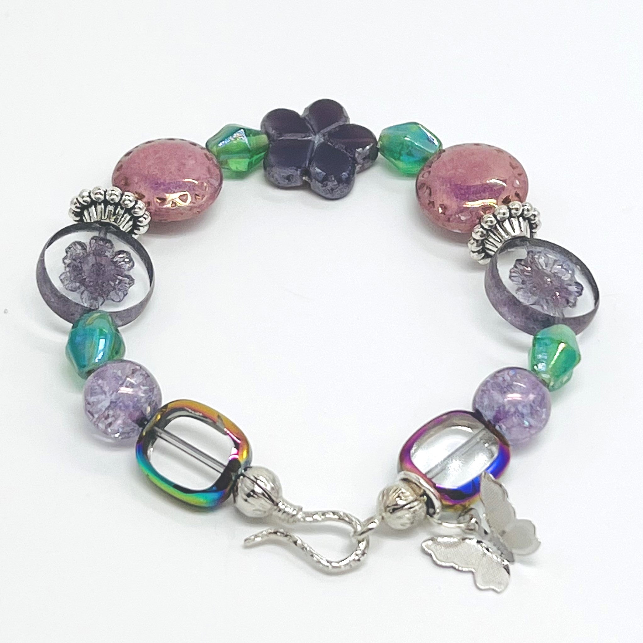 Romantic bracelet and earring set with Czech beads, glass beads in purple, pink and green with a silver butterfly dangle and silver accents